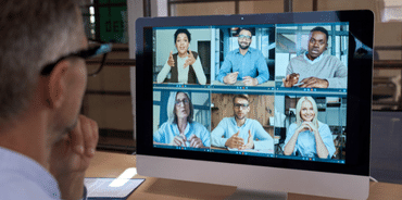 a group of people on a computer screen attending a virtual event